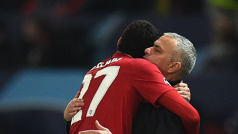 Marouane Fellaini celebrates with Jose Mourinho