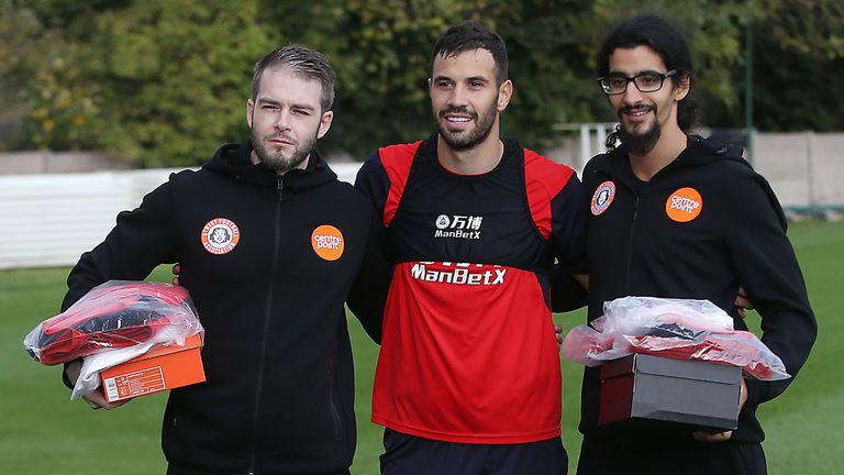 Milivojevic has a picture with the England Homeless players. 