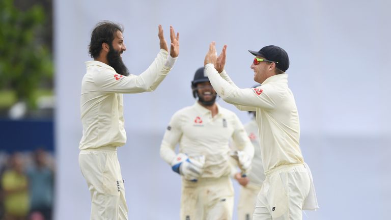 England bowler Moeen Ali celebrates with Jos Buttler after the pair combined to dismiss Sri Lanka batsman Angelo Matthews (not pictured) during Day Four of the First Test match between Sri Lanka and England at Galle International Stadium on November 9, 2018 in Galle, Sri Lanka