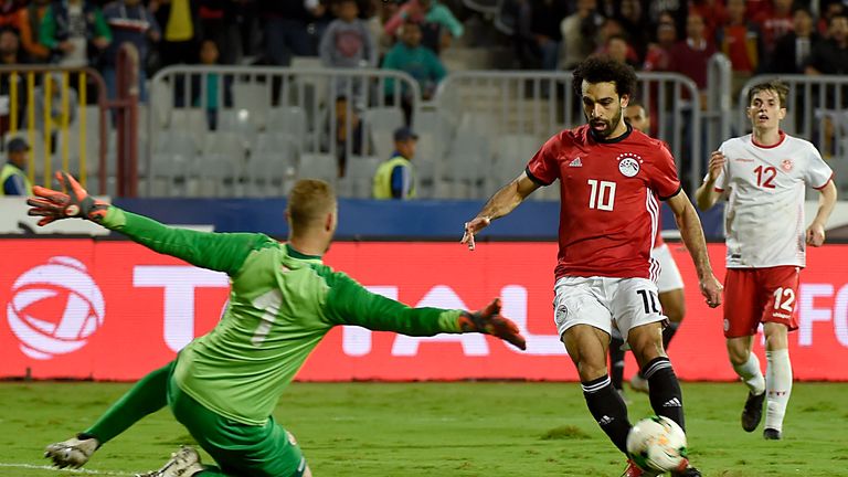 Egypt's forward Mohamed Salah (R) scores a goal during the Africa Cup of Nations qualifier football match Egypt vs Tunisia at the Borg El Arab Stadium, near Alexandria, on November 16, 2018.