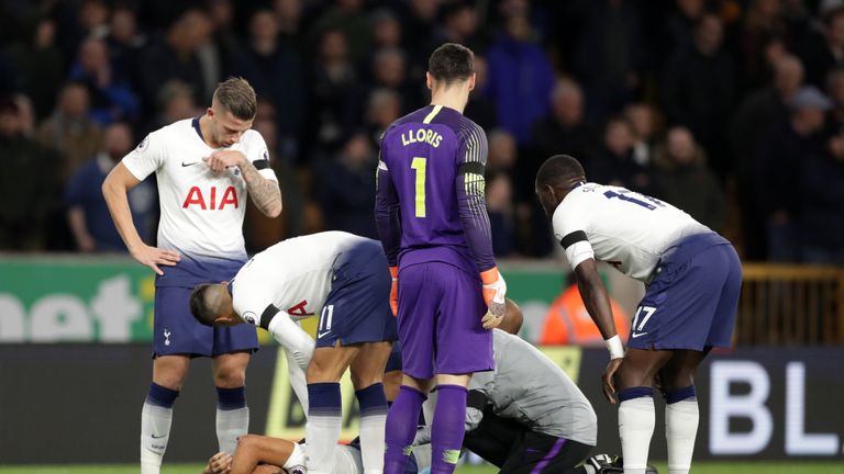 Mousa Dembele of Tottenham Hotspur lies injured and receives medical treatment during the Premier League match between Wolverhampton Wanderers and Tottenham Hotspur at Molineux on November 3, 2018 in Wolverhampton, United Kingdom.