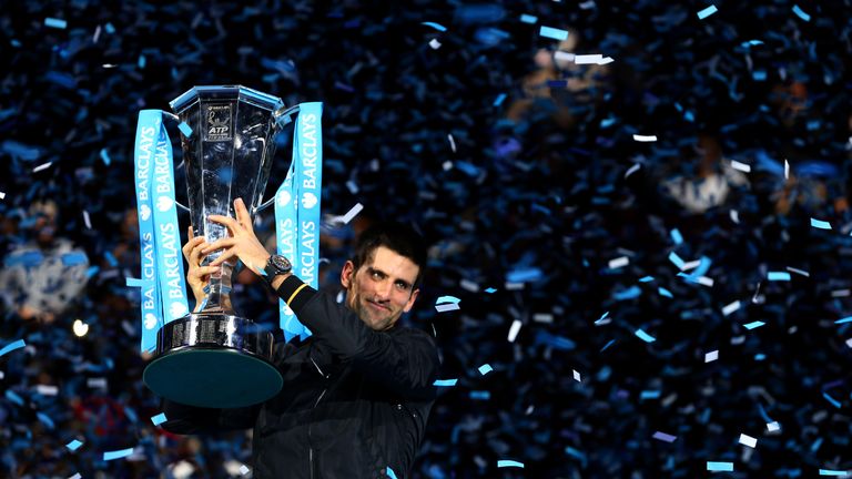 Novak Djokovic of Serbia lifts the trophy as he celebrates victory after his men's singles final match against Roger Federer of Switzerland during day eight of the ATP World Tour Finals at O2 Arena on November 12, 2012 in London, England.