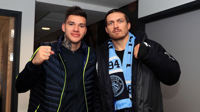 Ederson of Manchester City poses for a picture with Oleksandr Usyk