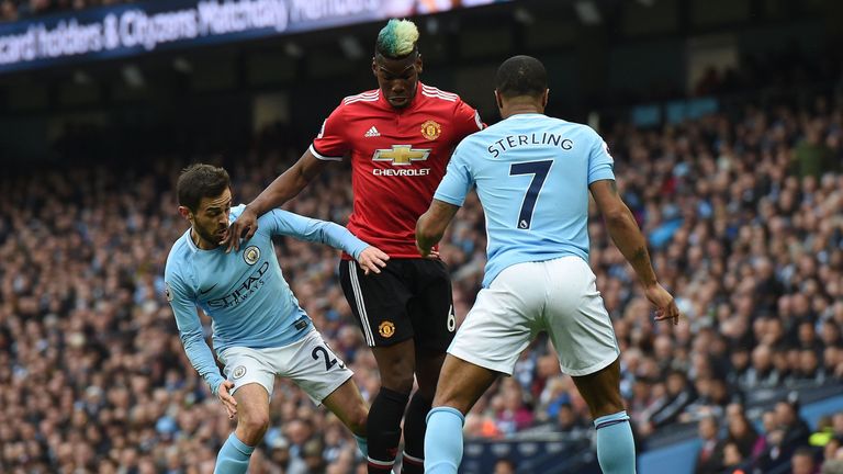 Paul Pogba and Raheem Sterling battle in last year's Manchester derby