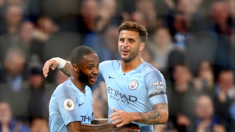 Raheem Sterling celebrates with Kyle Walker after putting City 5-1 up