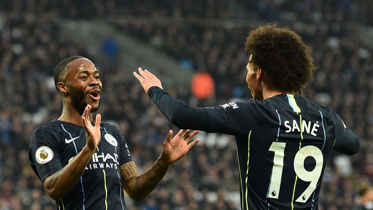 Raheem Sterling celebrates with Leroy Sane after putting Manchester City 2-0 up