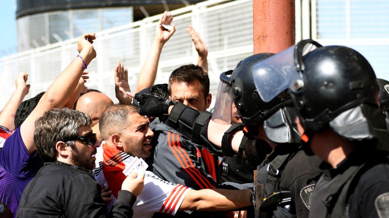 River Plate fans clashed with police before the original game on Saturday, when the Boca Juniors bus was attacked