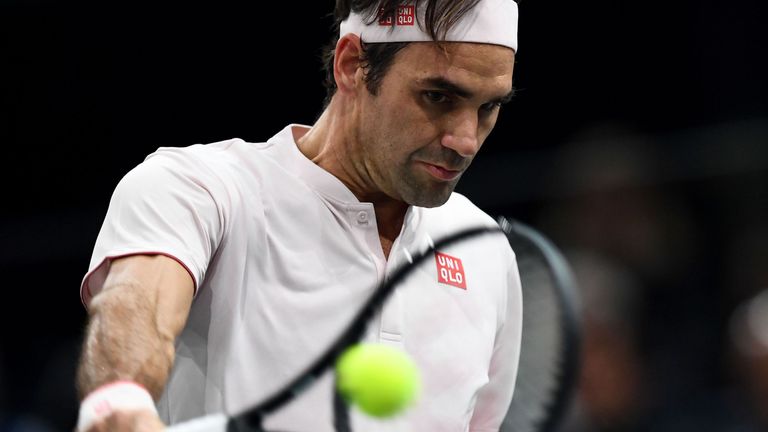 Roger Federer returns the ball to Japan's Kei Nishikori during their men's singles quarter-final tennis match on day five of the ATP World Tour Masters 1000 - Rolex Paris Masters