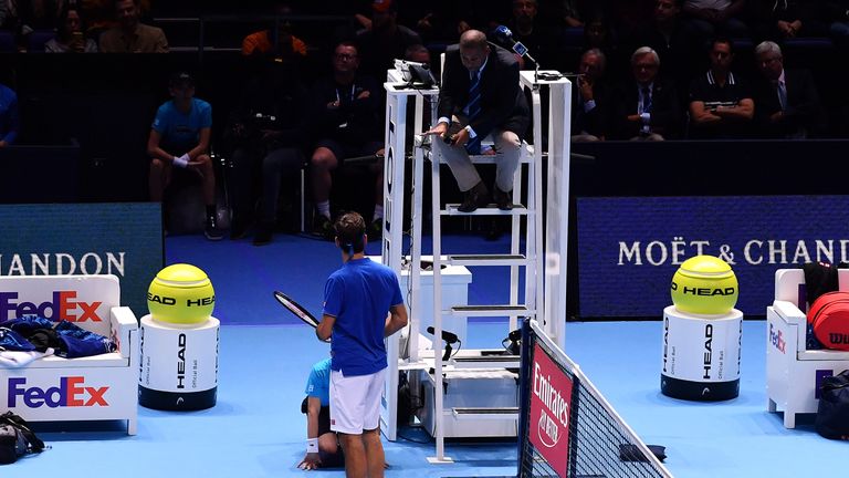 Roger Federer of Switzerland speaks to the umpire after a ball boy dropped a ball in his semi finals singles match against Alexander Zverev of Germany during Day Seven of the Nitto ATP Finals at The O2 Arena on November 17, 2018 in London, England