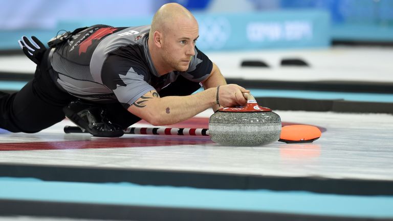Canada's Ryan Fry throws the stone during the Men's Curling Gold Medal Game against Great Britain during the Sochi Winter Olympics in 2014