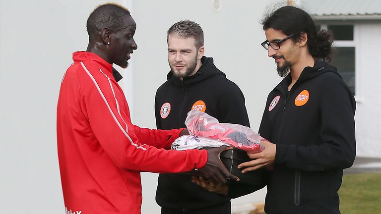 Sakho gifting Crystal Palace gear to England Homeless players.