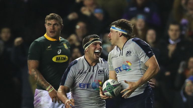 Stuart McInally celebrates after Hamish Watson scores Scotland's second try