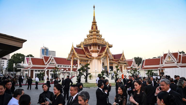 Mourners arrive at the Wat Thepsirin Buddhist temple for the funeral of Leicester owner Vichai Srivaddhanaprabha