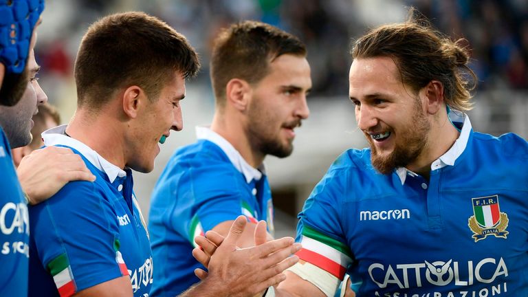 Italy's fly half Tommaso Allan (L) celebrates with Italy's centre Michele Campagnaro after scoring a try during the international rugby union test match Italy vs Georgia on November 10, 2018 in Florence.