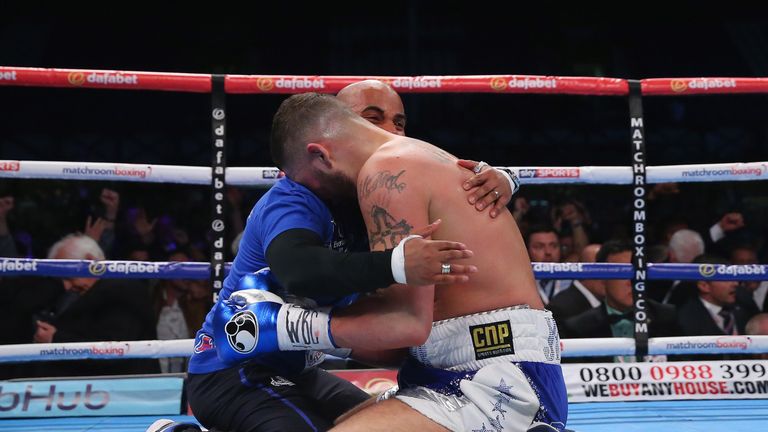 Tony Bellew celebrates with his trainer Dave Coldwell after stopping Illunga Makabu in the second round to win the Vacant WBC World Cruiserweight Championship fight between Tony Bellew and Illunga Makabu at Goodison Park on May 29, 2016 in Liverpool, England.