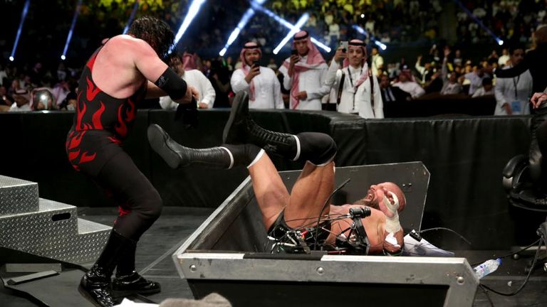 Triple H continued to compete after getting injured, even being chokeslammed through a table