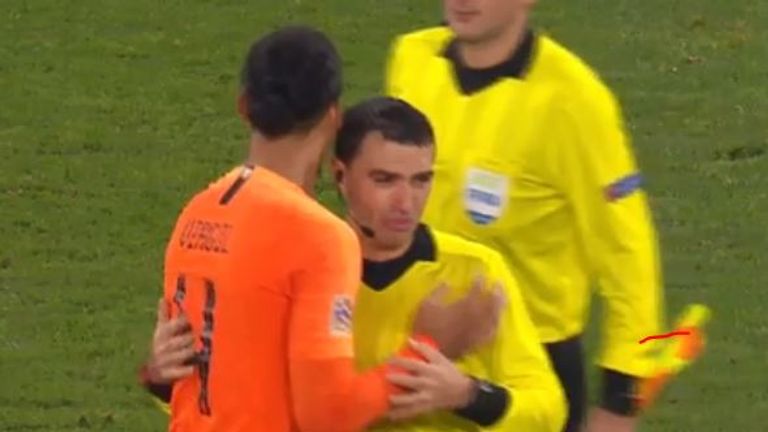 Virgil van Dijk comforts referee after Holland match