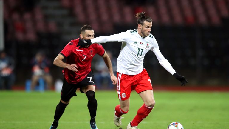 Albania's Eros Grezda (left) and Wales' Gareth Bale (right) battle for the ball 