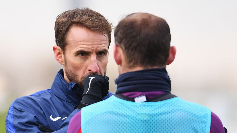 Gareth Southgate interim manager of England in discussion with Wayne Rooney during an England training session at St Georges Park on November 8, 2016 in Burton-upon-Trent, England. England are due to face Scotland in a World Cup qualifier on November 11 at Wembley.