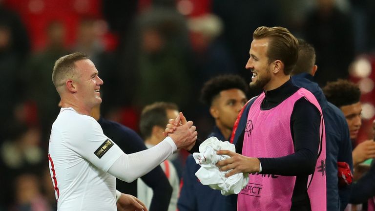 Wayne Rooney shakes hands with Harry Kane at full-time
