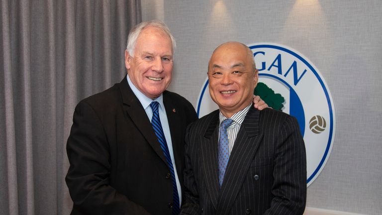 IEC CEO Melvin Yan Min Zhang poses with director Joe Royle