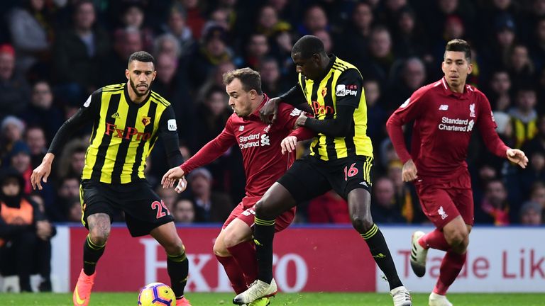 Xherdan Shaqiri and Abdoulaye Doucoure battle for the ball at Vicarage Road