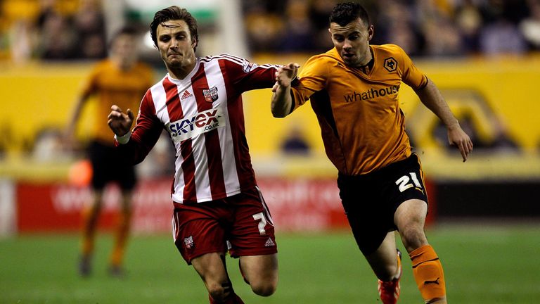 WOLVERHAMPTON, ENGLAND - NOVEMBER 23: Zeli Ismail of Wolves battles with Sam Saunders of Brentford during the Sky Bet League One game between Wolverhampton Wanderers and Brentford at Molineux on November 23, 2013 in Wolverhampton, England.  (Photo by Ben Hoskins/Getty Images)