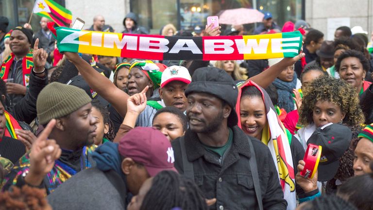 Zimbabweans gather outside the Zimbabwe Embassy in London, to demonstrate in support of the ousting of President Robert Mugabe, 18 November 2017