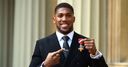 WATCH: AJ receives OBE at the Palace