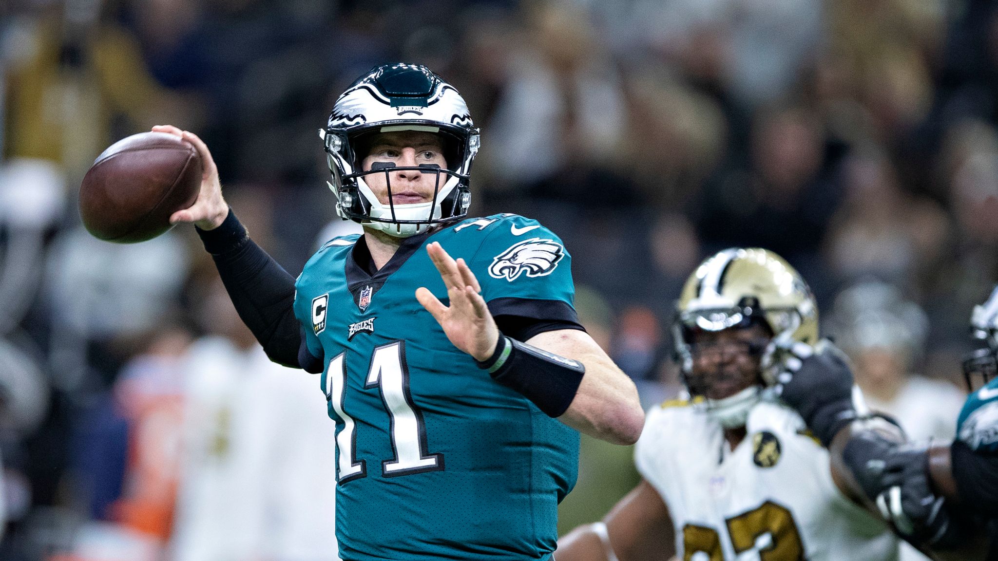 Philadelphia Eagles quarterback Carson Wentz takes the snap from