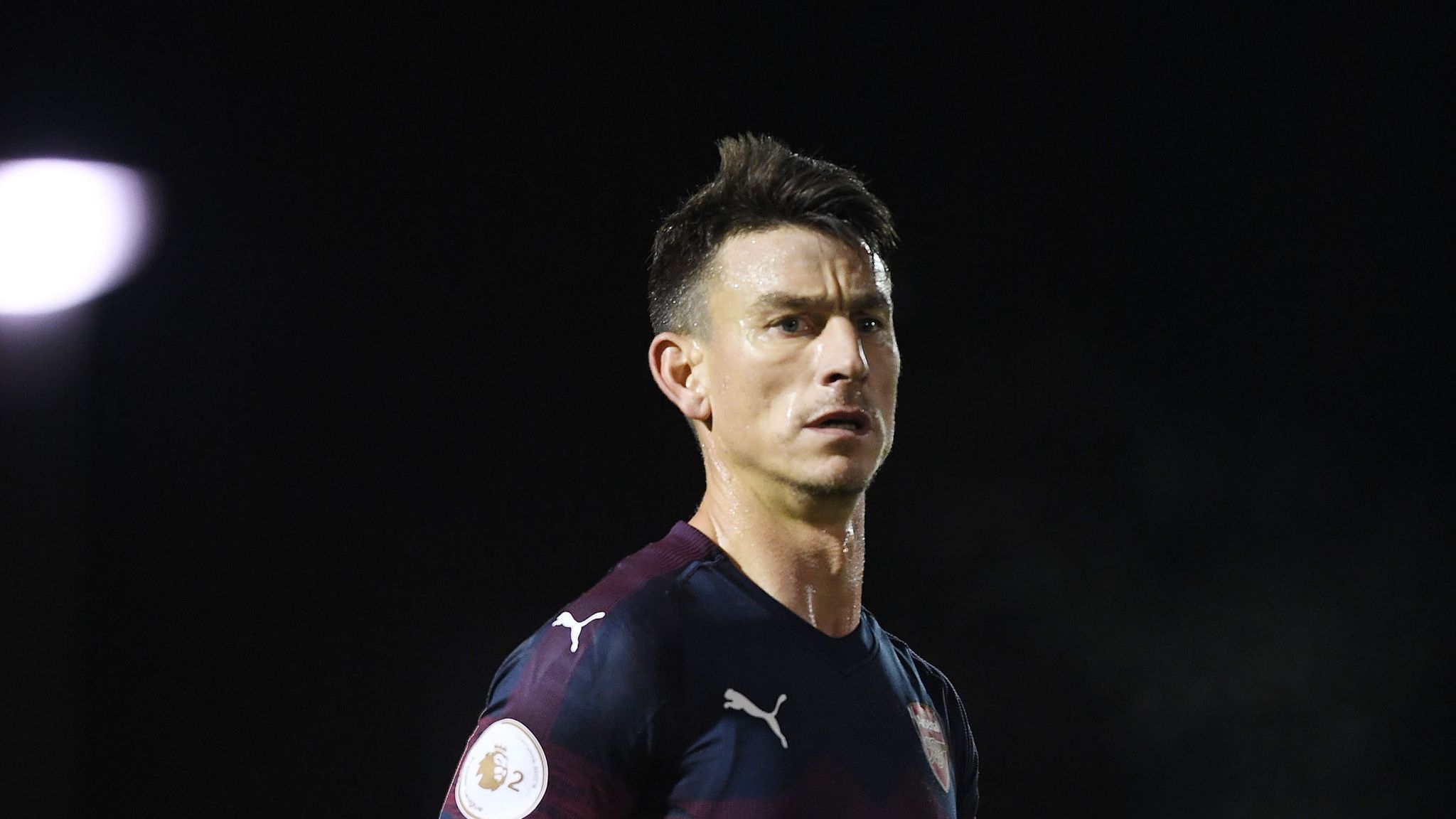 Laurent Koscielny limps off for Arsenal U21s on comeback from Achilles