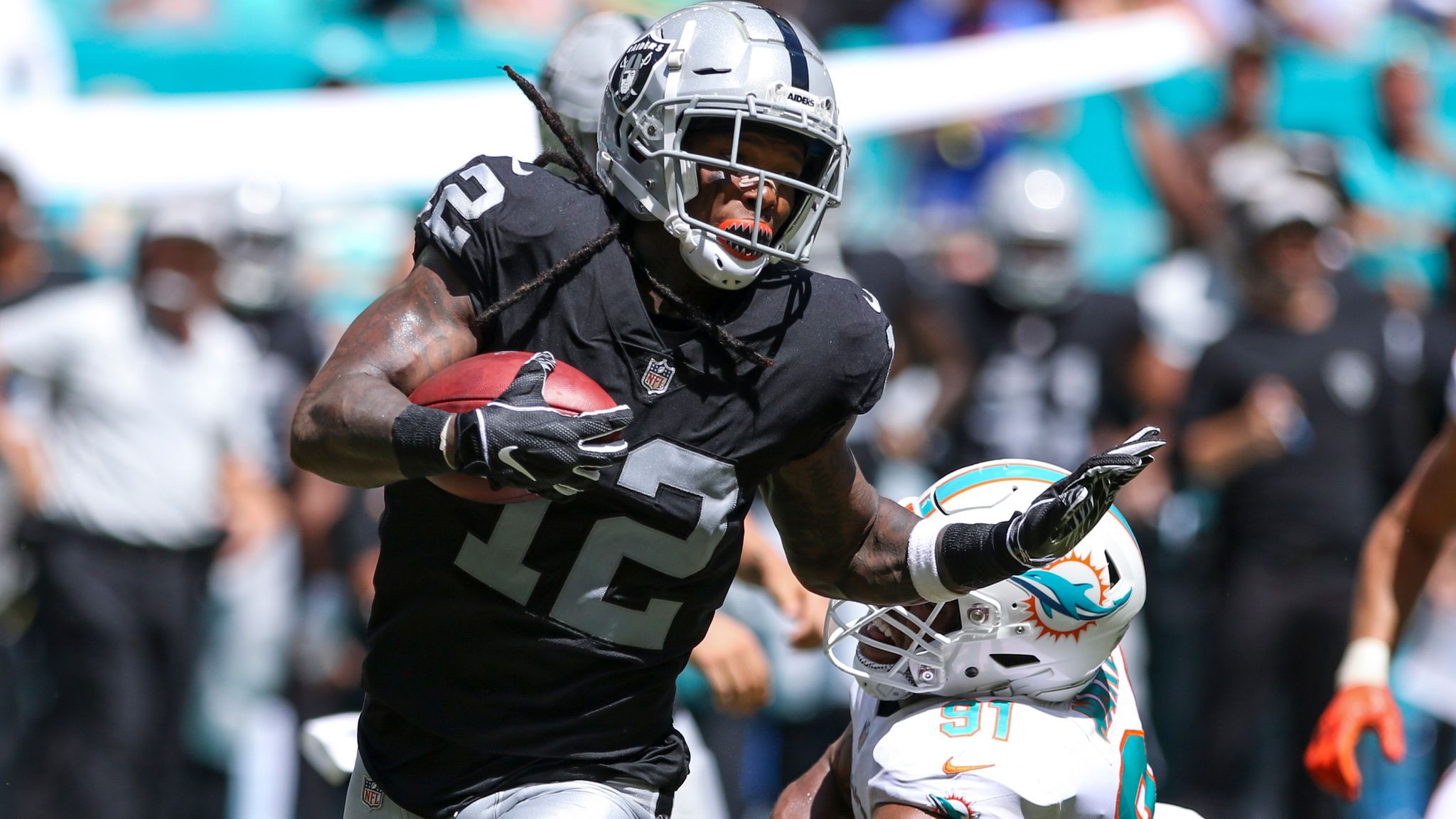 Oakland Raiders wide receiver Martavis Bryant (12) tries to break