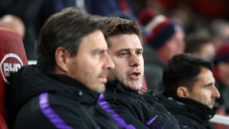 Mauricio Pochettino looks on from the bench at the Emirates