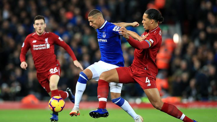 Richarlison is challenged by Virgil van Dijk