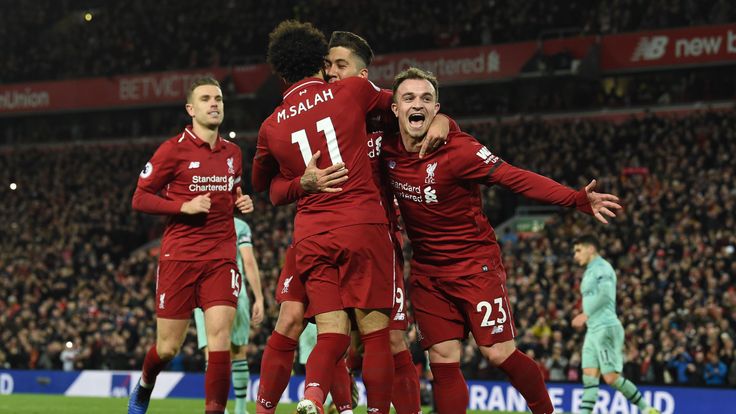 Roberto Firmino celebrates his third goal with Mohamed Salah and Xherdan Shaqiri