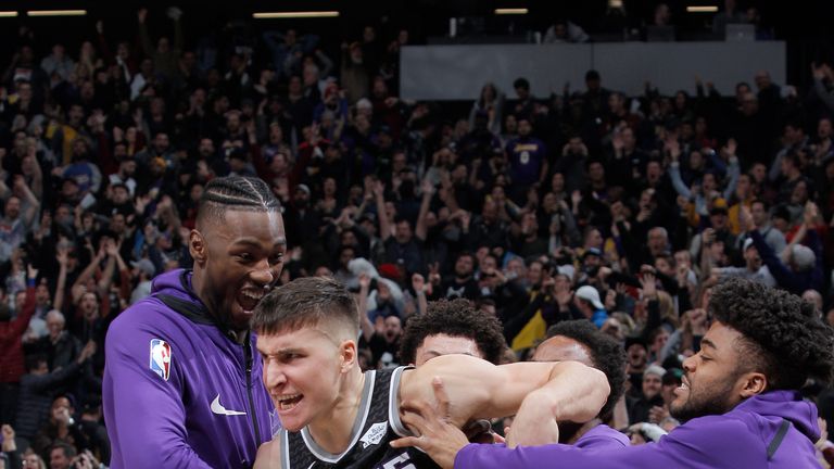 Bogdan Bogdanovic is mobbed by team-mates after hitting a gam-winning three-pointer at the buzzer