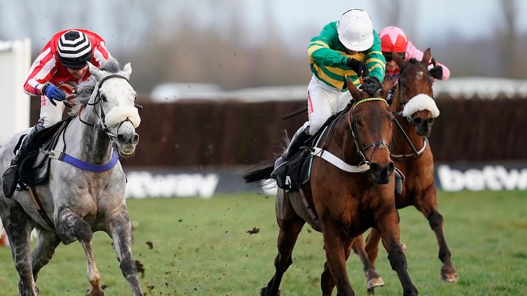 Barry Geraghty riding Champ (green and gold) en route to winning the Challow Hurdle