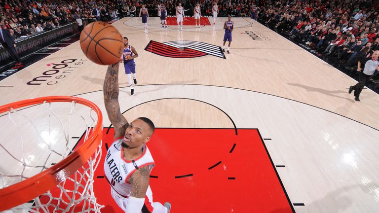 Damian Lillard scores with a breakaway dunk