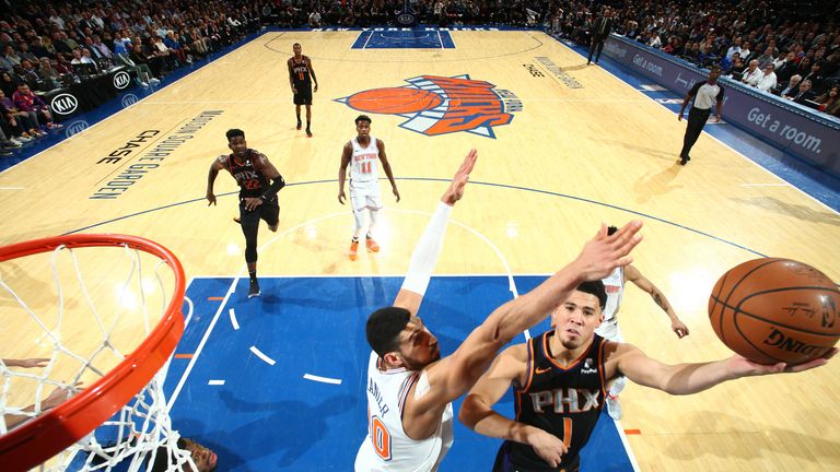 Devin Booker attacks the rim against the New York Knicks