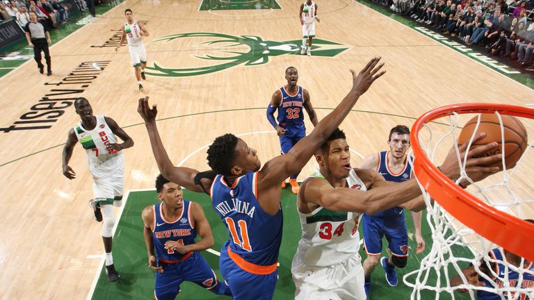 Giannis Antetokounmpo finishes at the rim against the Knicks