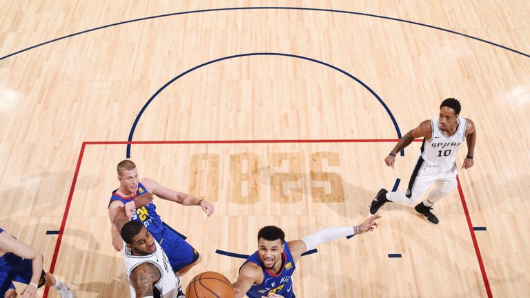 Jamal Murray finishes at the rim against San Antonio