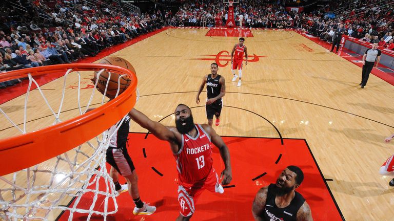 James Harden scores with a finger roll against Washington