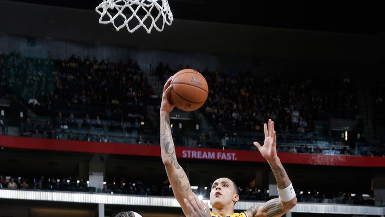 Kyle Kuzma scores with a finger roll