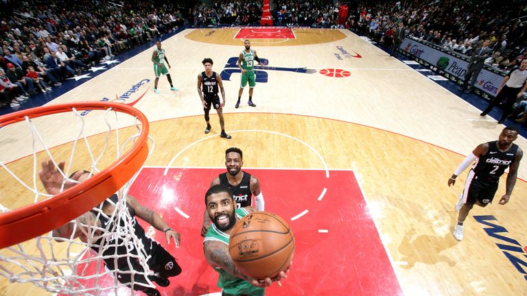 Kyrie Irving scores at the rim against Washington