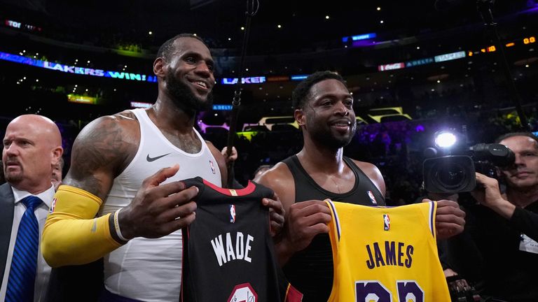 LeBron James and Dwyane Wade swap jerseys after facing off for the final time