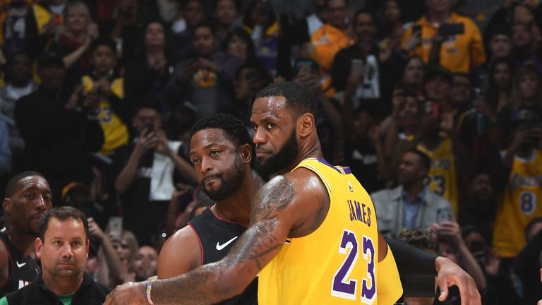 LeBron James guards former team-mate Dwyane Wade