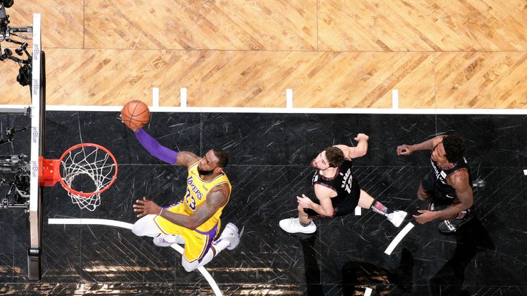 LeBron James scores with a lay-up against the Brooklyn Nets