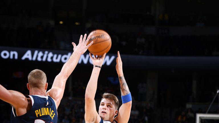 Luka Doncic fires a jump shot against Denver