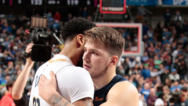 Luka Doncic is congratulated by Anthony Davis