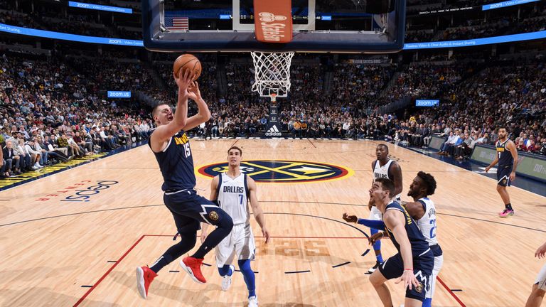 Nikola Jokic scores against the Dallas Mavericks